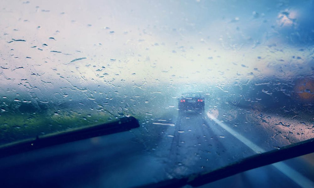 Blog - Hydroplaning 101 - Rainy Window Shield On A Car While Driving